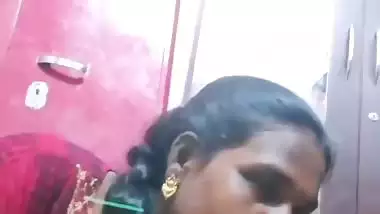 Mature tattooed Tamil wife giving handjob to husband