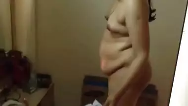 Paunchy Desi woman with small tits shows her body in the porn video